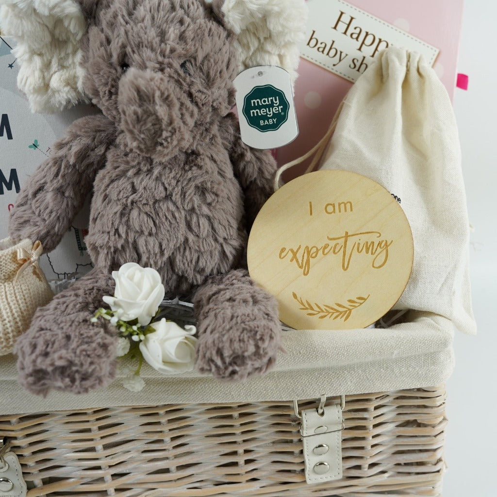 Baby shower gift, neutral hamper with baby blanket, mum to mum gift book, baby booties, mum and baby toiletries, pregnancy wooden milestone gifts, baby muslin swaddle, baby soft elephant toy