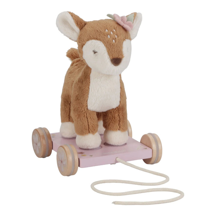 soft pull along deer on a pink wooden trolley