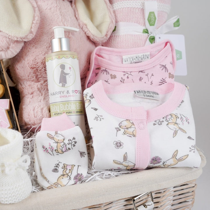 baby girl hamper basket, white layette with pink trim and bunnies, pink eco bunny, baby themed biscuits in a box, sophie la girafe so pure, baby pink and white striped blanket, baby organic wash