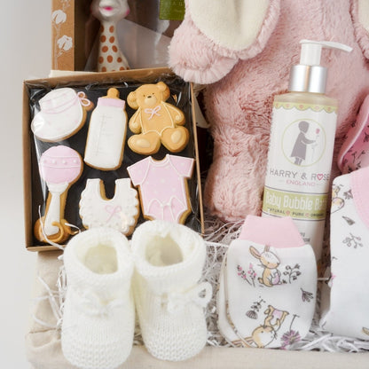 baby girl hamper basket, white layette with pink trim and bunnies, pink eco bunny, baby themed biscuits in a box, sophie la girafe so pure, baby pink and white striped blanket, baby organic wash