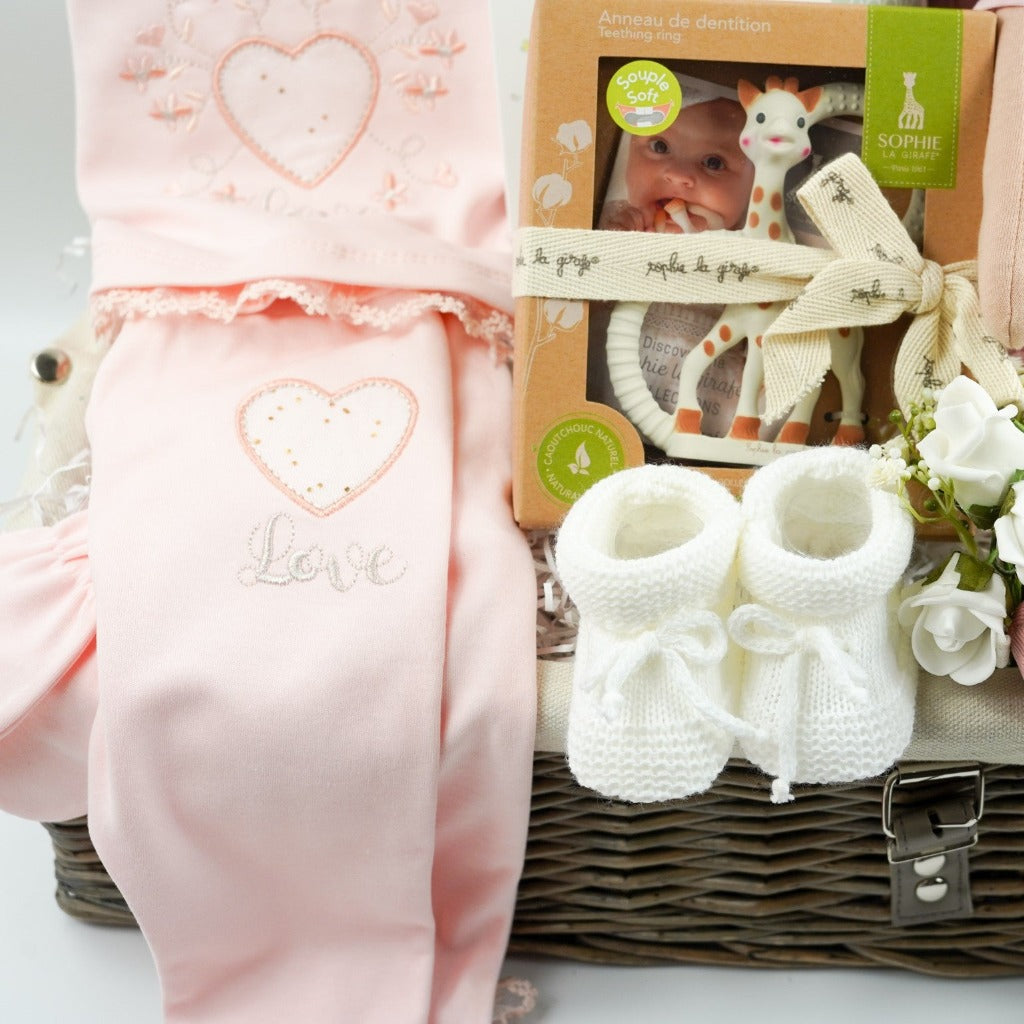 baby girl gift basket, peach spanish clothing set, sophie la giraffe teether, Little Butterfly London baby toiletries, rag doll toy, white muslin with grey elephants , white knit booties