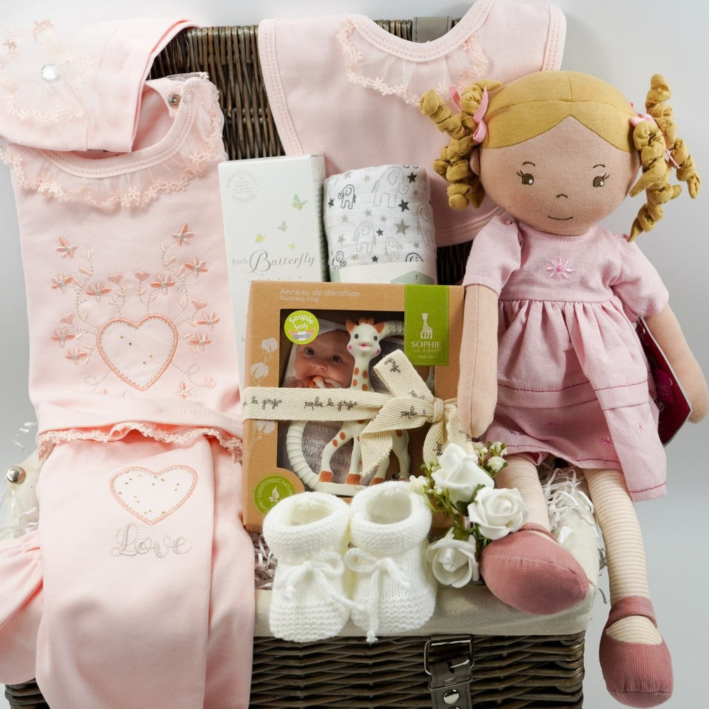 baby girl gift basket, peach spanish clothing set, sophie la giraffe teether, Little Butterfly London baby toiletries, rag doll toy, white muslin with grey elephants , white knit booties