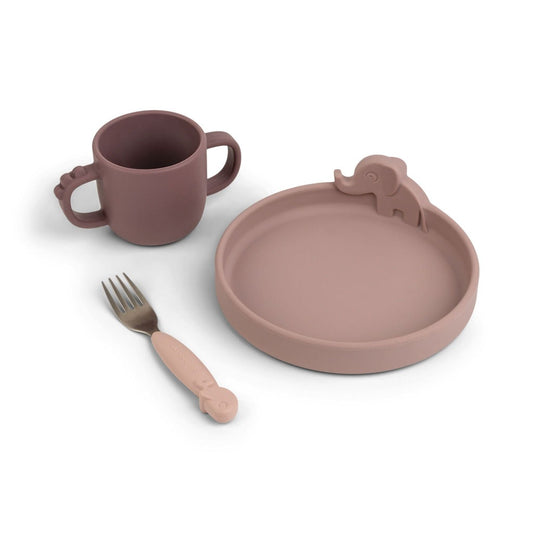 Silicone baby feeding set includes a dusty pink bowl with an elephant, two handled baby silicone  mug, baby fork with pink silicone handle 