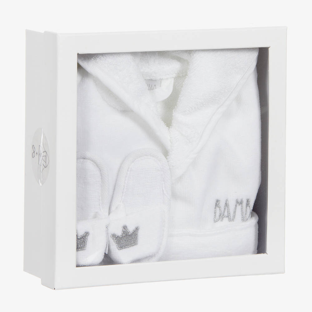 boxed white fluffy cotton baby dressing gown with Bam Bam embroidered, white slip on baby slippers with a crown embroidered