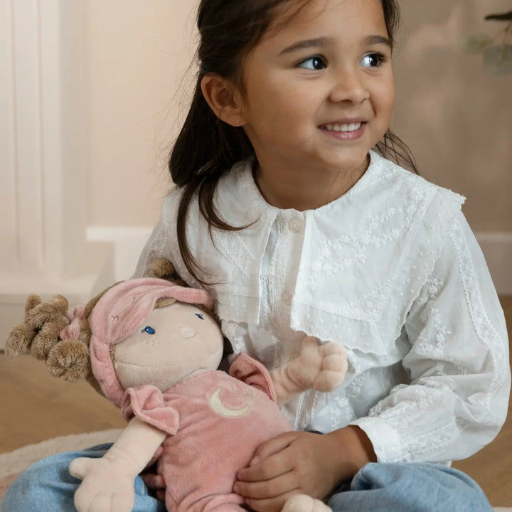 soft doll rosa in a sleeping bag