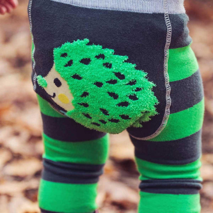 green, grey and black leggings with hedgehog on the bottom 