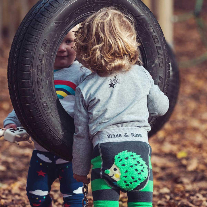 green, grey and black leggings with hedgehog on the bottom 