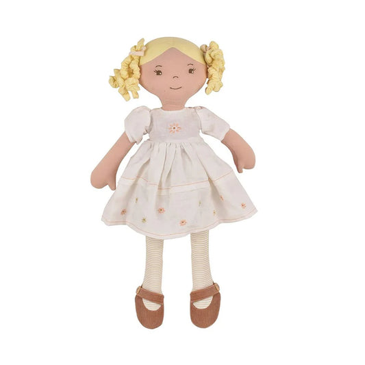 rag doll in a whire dress with blonde hair 