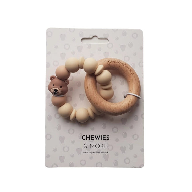 Teething ring with bear design on a 'Chewies & More' branded card against a white background
