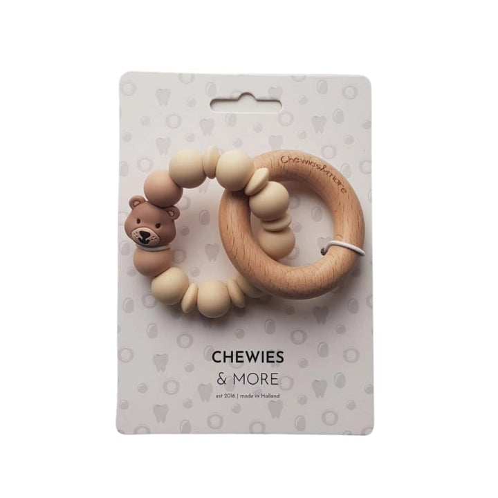 Teething ring with bear design on a 'Chewies & More' branded card against a white background