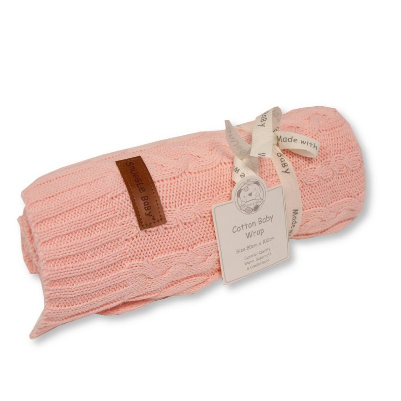 pink cable knit baby wrap in a roll tied with ribbon