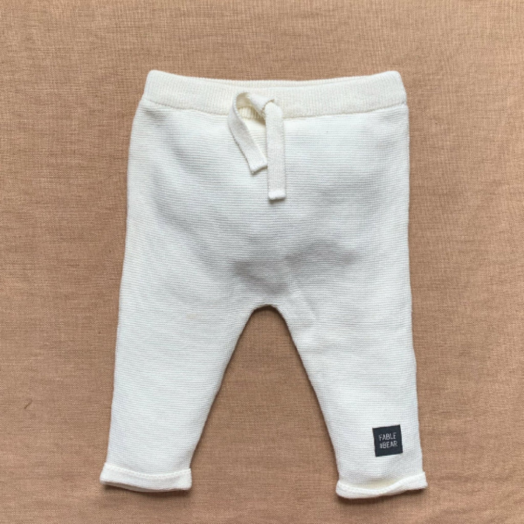black baby joggers and cream baby joggers in organic cotton