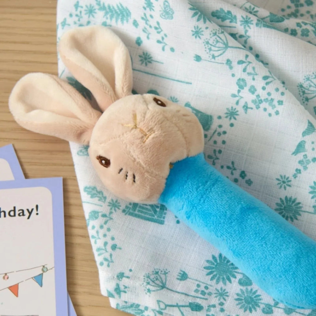 Peter rabbit gift keepsake box full of peter rabbit gifts including a blue peter rabbit comforter, soft toy and rattle, peter rabbit milestone cards 