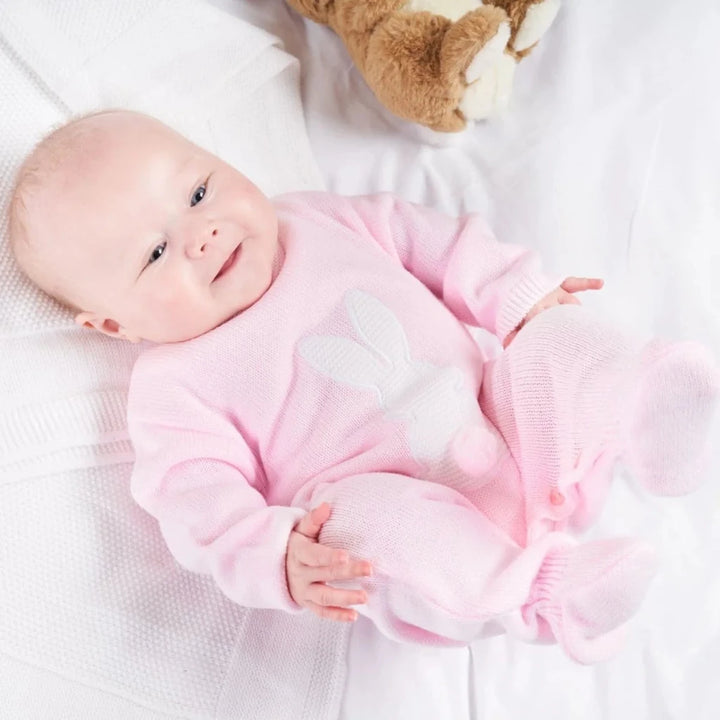 pink knit baby romper with white bunny with a bow