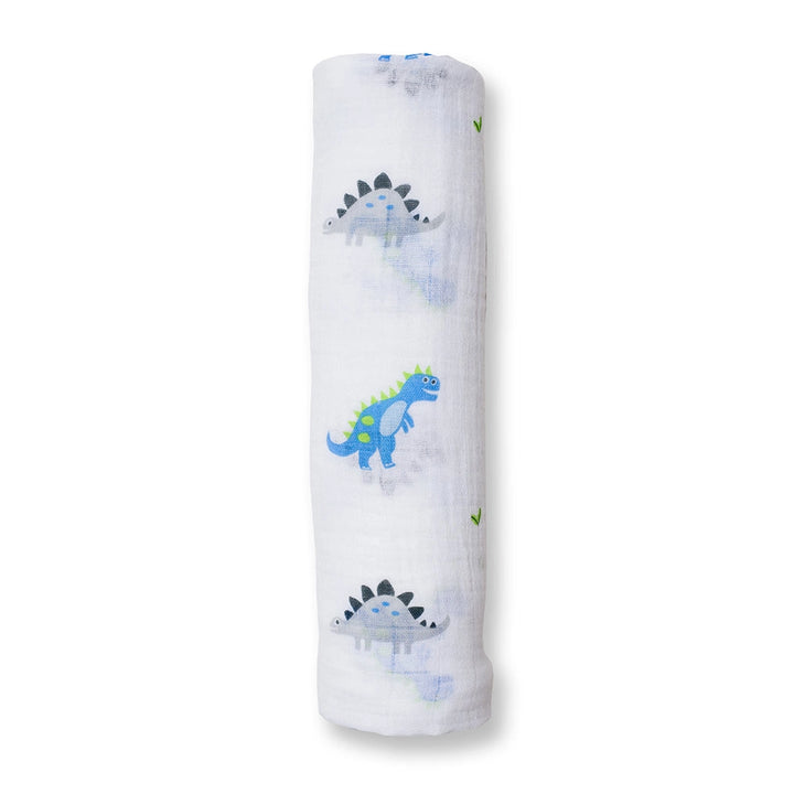 Rolled-up fabric with dinosaur patterns on a white background