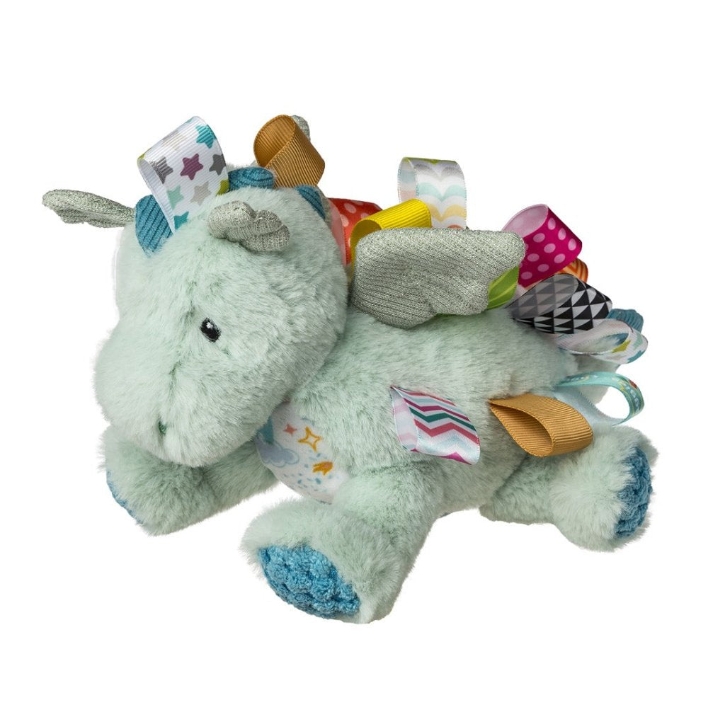 pale green dragon soft toy with brightly coloured taggies 