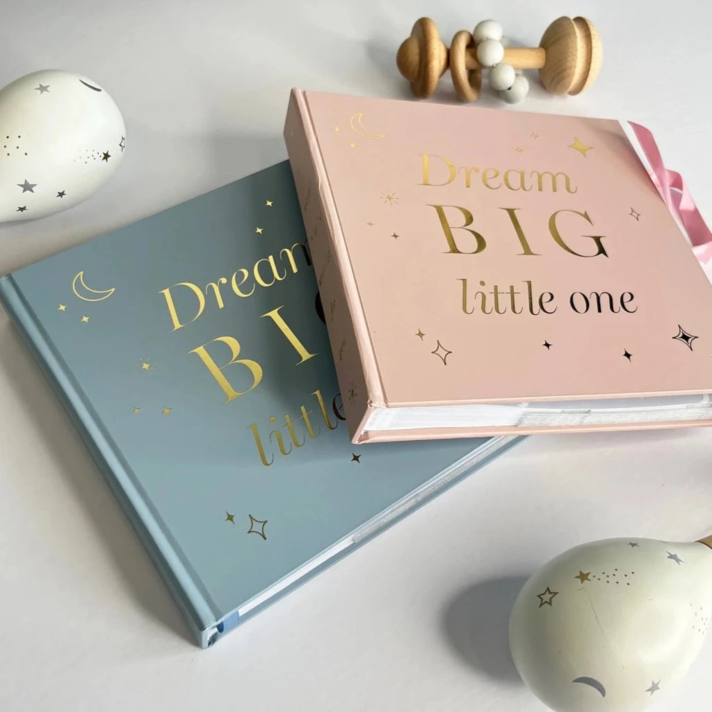 Dream big photo album for a baby, blue cover with gold writing and blue ribbon tie