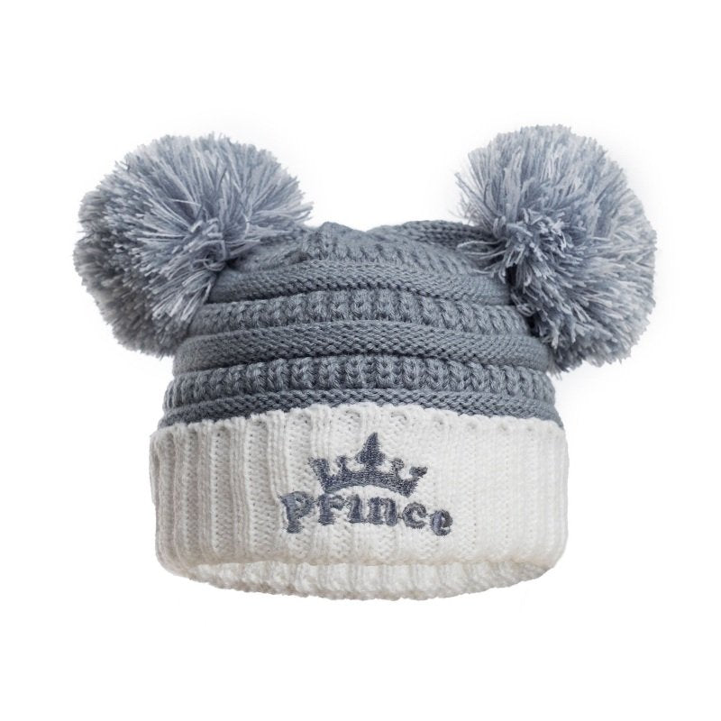 Dusty blue baby wooly hat with two pom poms and cream turn up with prince embroidered