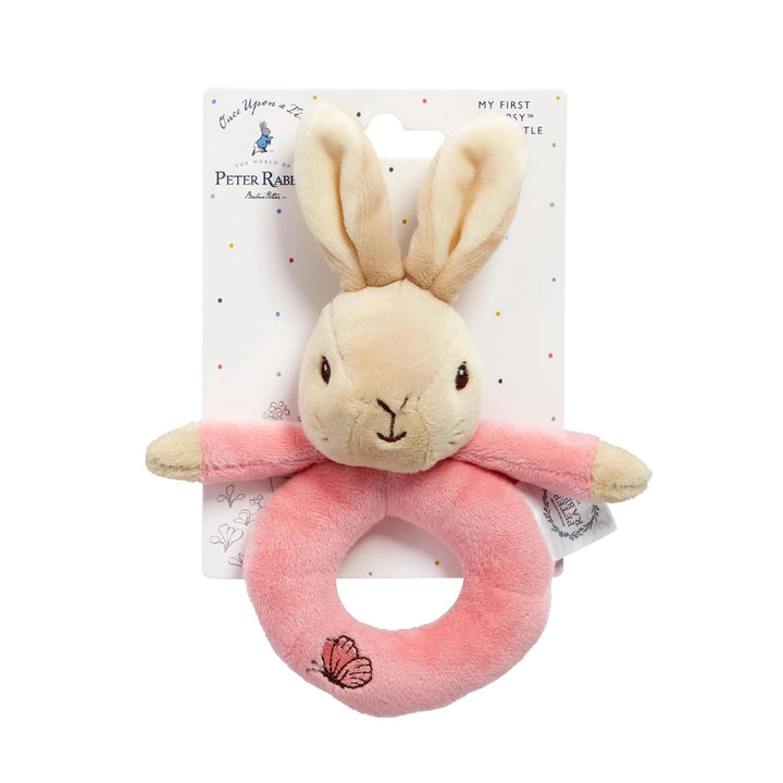 Peter Rabbit plush teething ring toy on its original white branded packaging card, featuring a beige rabbit head and a pink ring with a butterfly detail.