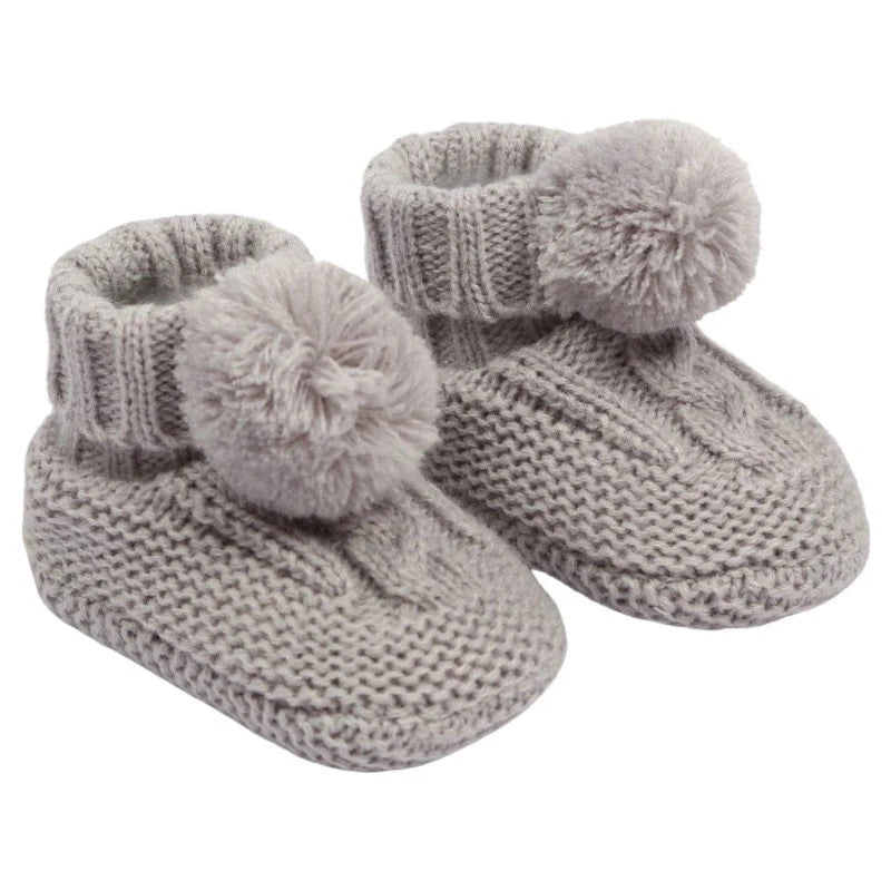 grey fully lined, cable knit baby booties with a pompom