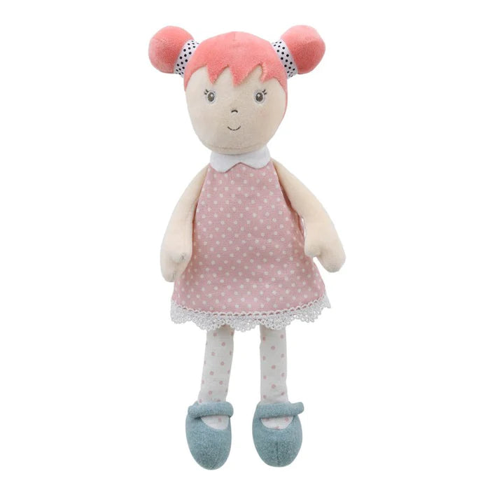 Soft bodied doll with a pink spotty dress and pink hair 