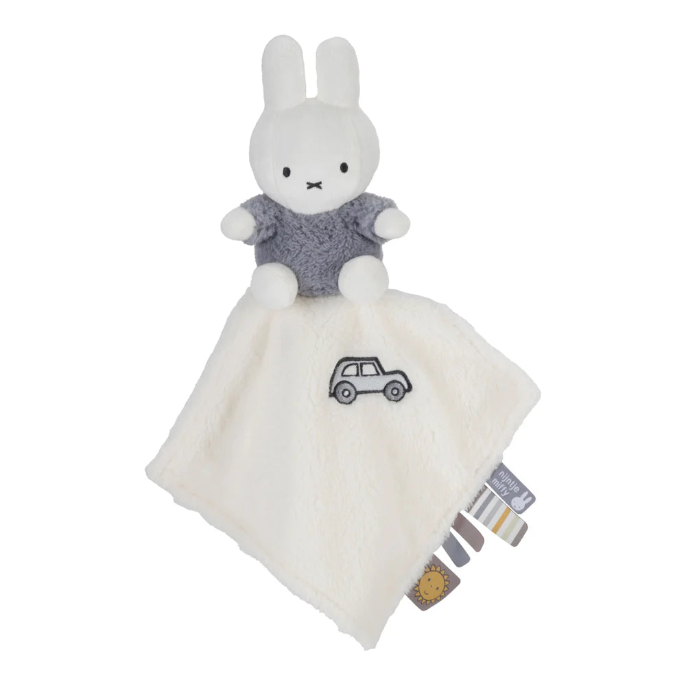 White miffy baby comforter , miffy sitting on cloth in blue fluffy outfit , taggies