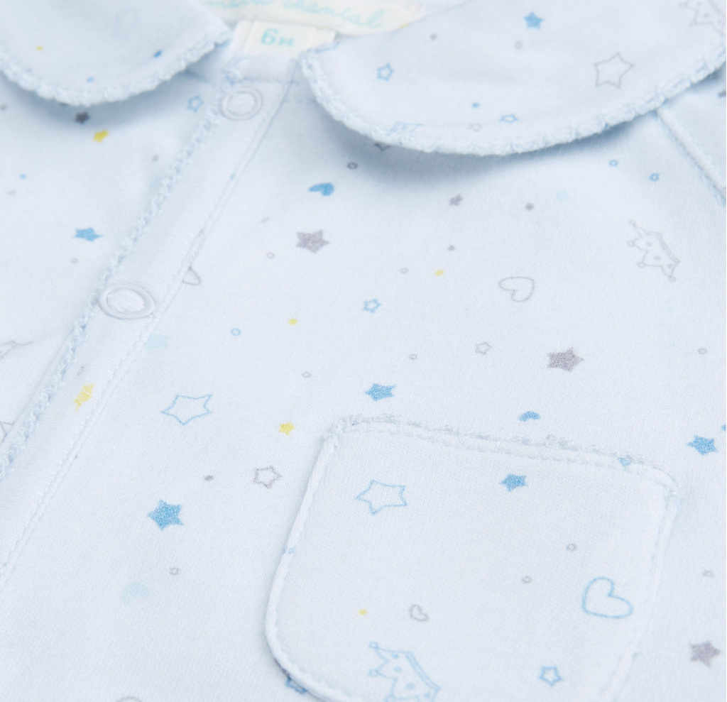 Marie chantal star and crown patterened sleepsuit in pale blue