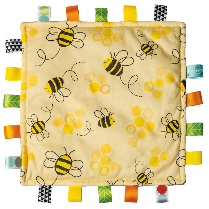 baby sensor taggie blanket with yellow bees and a fleecy lining , with lots of coloured ribbon taggies