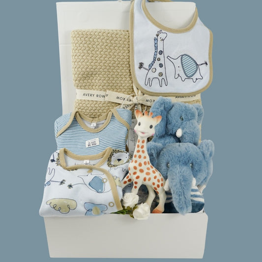 Organic baby clothing set in blue with elephants and girafees, organic heavy knit biscuit coloured baby blanket, soft eco friendly soft elephant and matching rattle in blue, sophie la girafee rubber teething toy