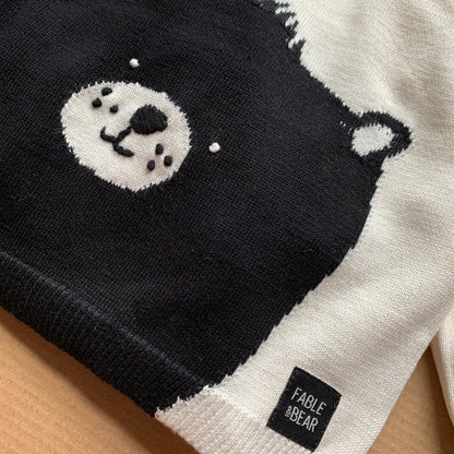 Cream and black baby jumper with bear face on the front and back