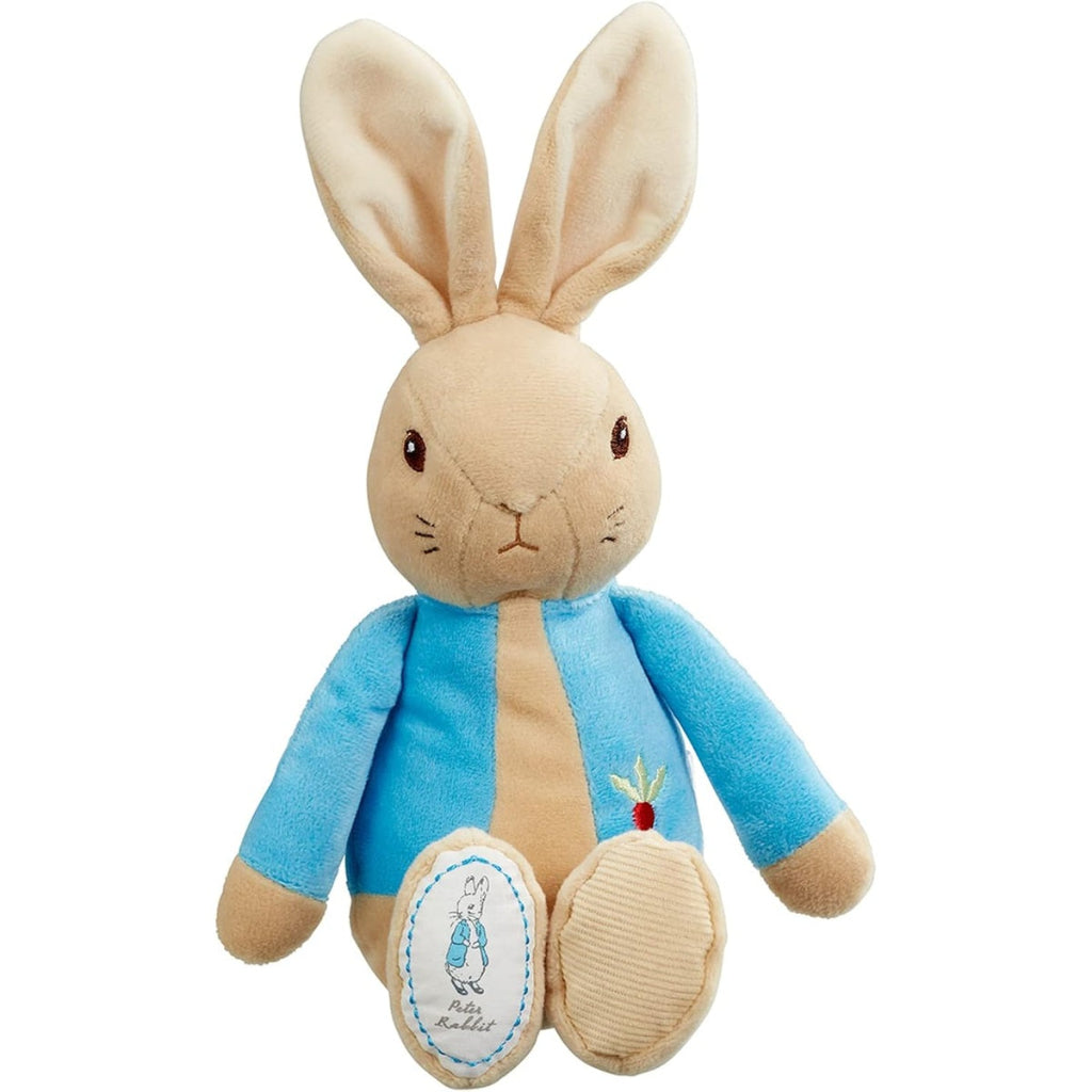 A plush toy of Peter Rabbit, featuring a beige rabbit body with long ears, wearing a blue jacket