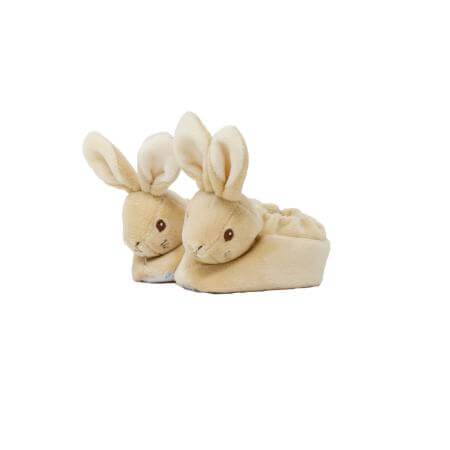 A pair of plush bunny slippers in a soft cream-beige color, featuring embroidered bunny faces and long upright ears, 