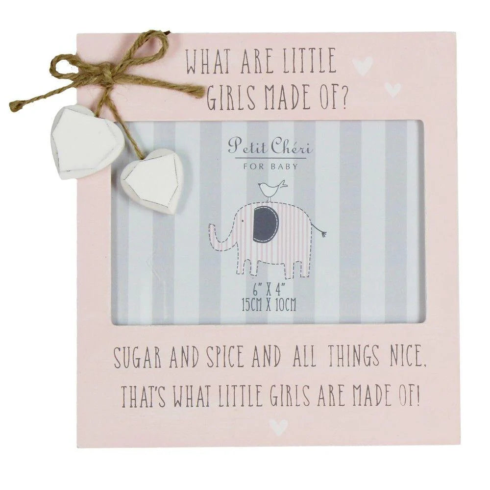 pink picture frame with writing 'what are little girls made of 'and hanging white hearts