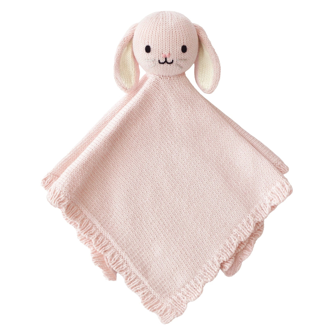 Pink knitted bunny comfort blanket on a white background