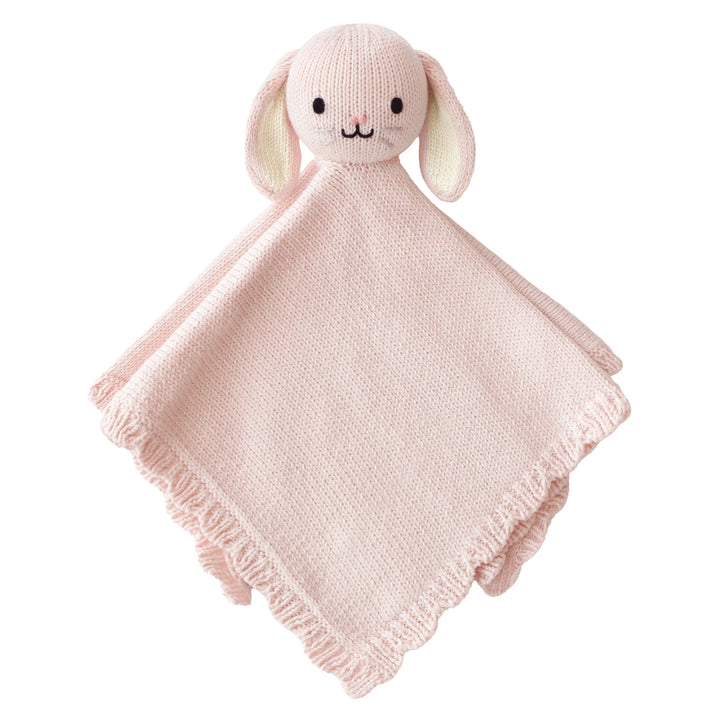 Pink knitted bunny comfort blanket on a white background