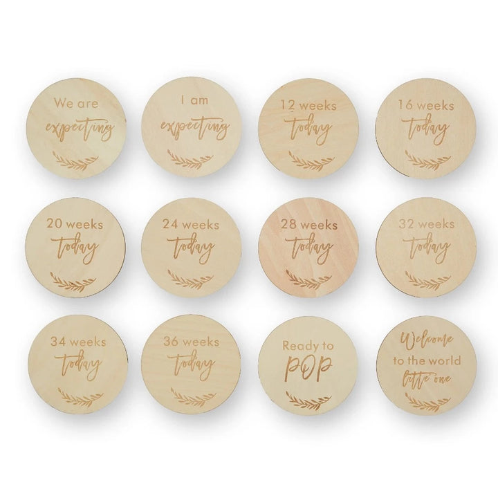 wooden pregnancy milestone discs in a natural drawstring bag