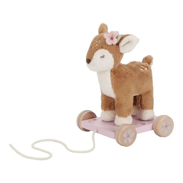 soft pull along deer on a pink wooden trolley