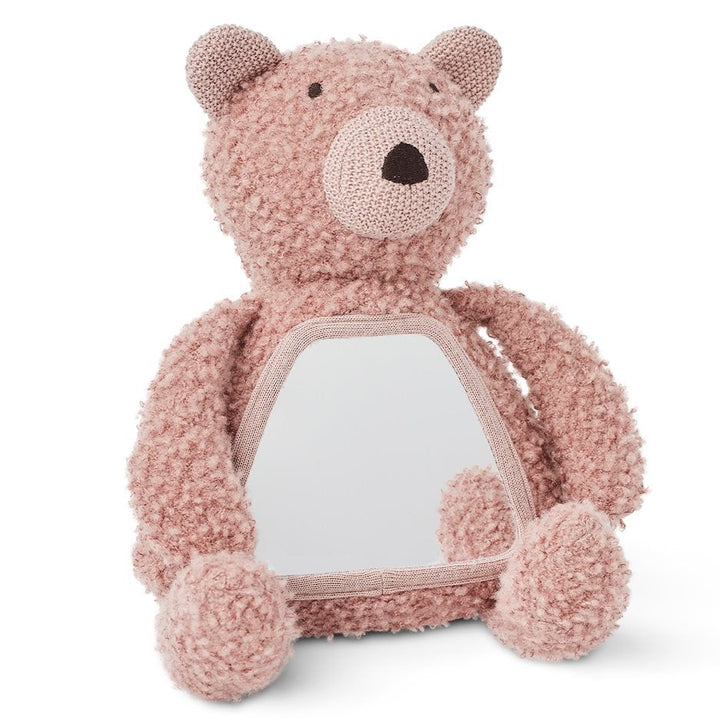 Pink teddy bear with a white belly on a white background
