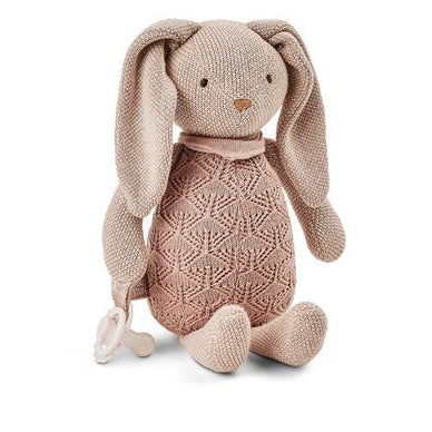 Knitted bunny toy with a pink sweater on a white background