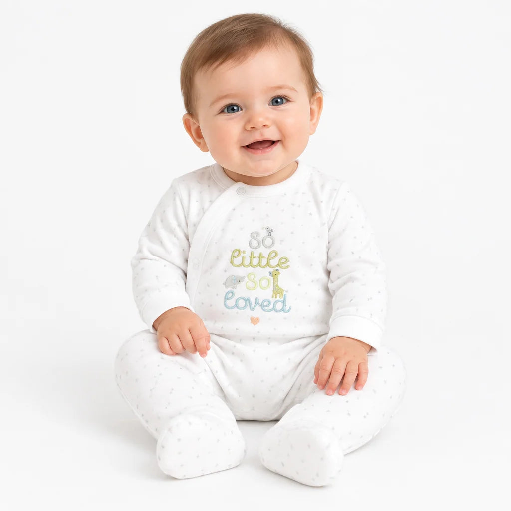 white baby sleepsuit with so little so loved writted on the front