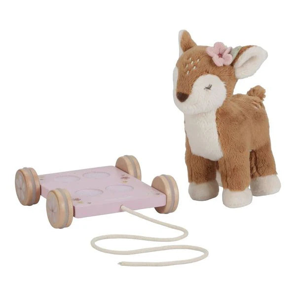 soft pull along deer on a pink wooden trolley