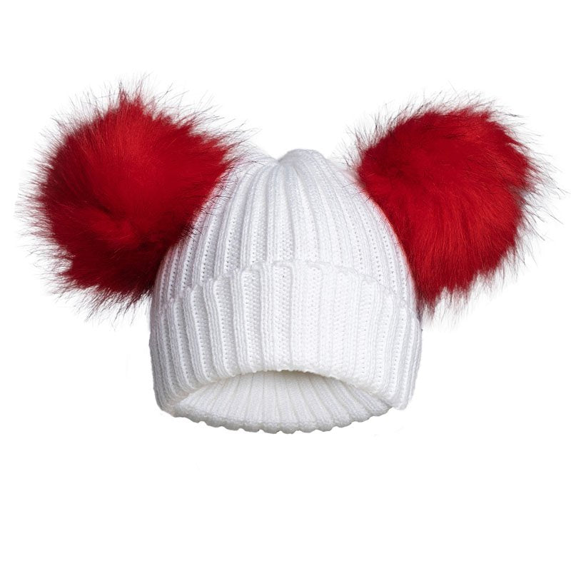 white knit hat with red pom poms 