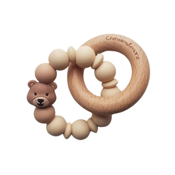 Wooden teething ring with bear-shaped handle on a white background