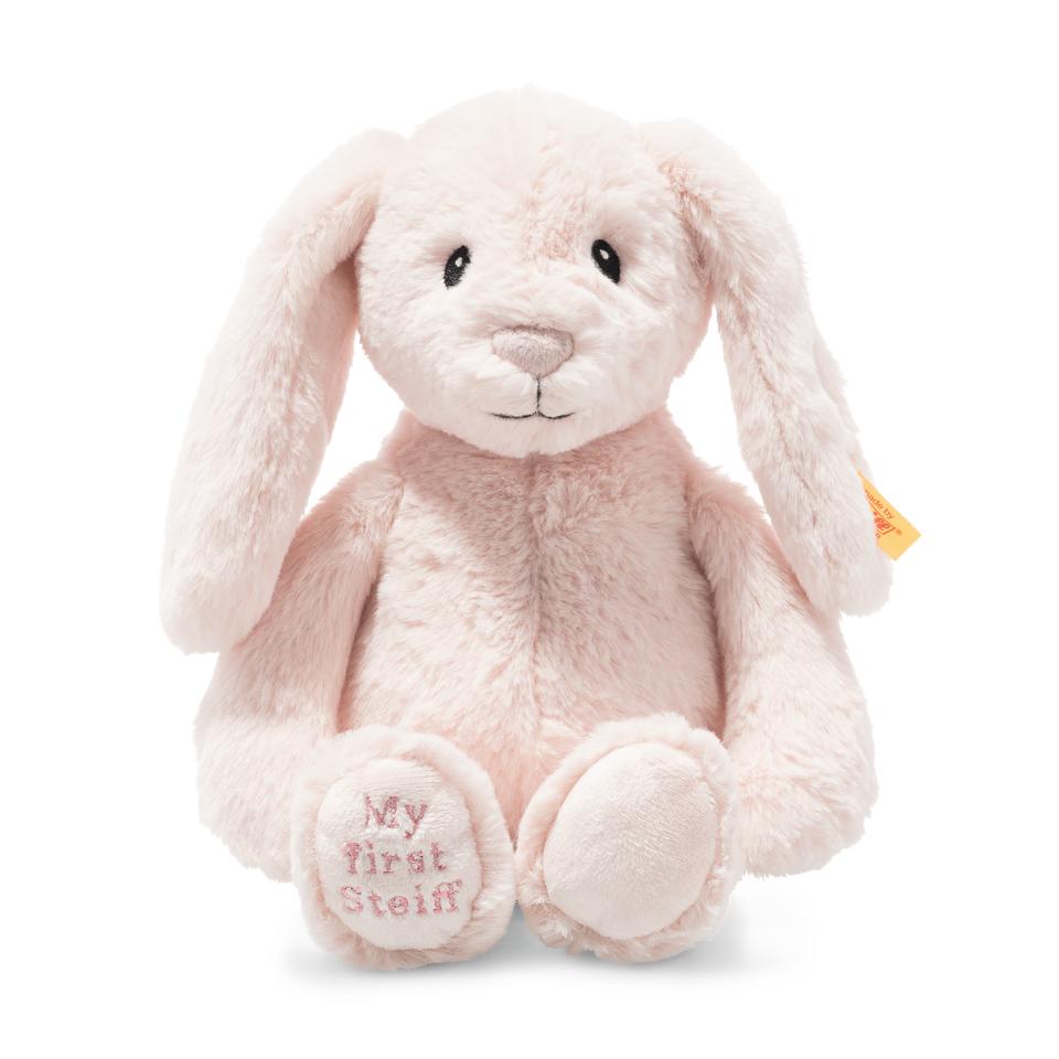 Pink floppy ear rabbit baby soft toy by Steiff with button on ear and My First Steiff embroidered on foot