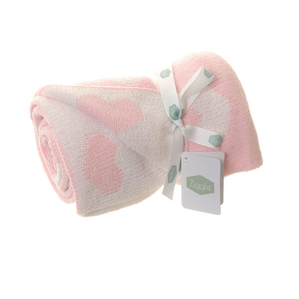 Pink and white chenille baby blanket rolled up and ties with a bow 