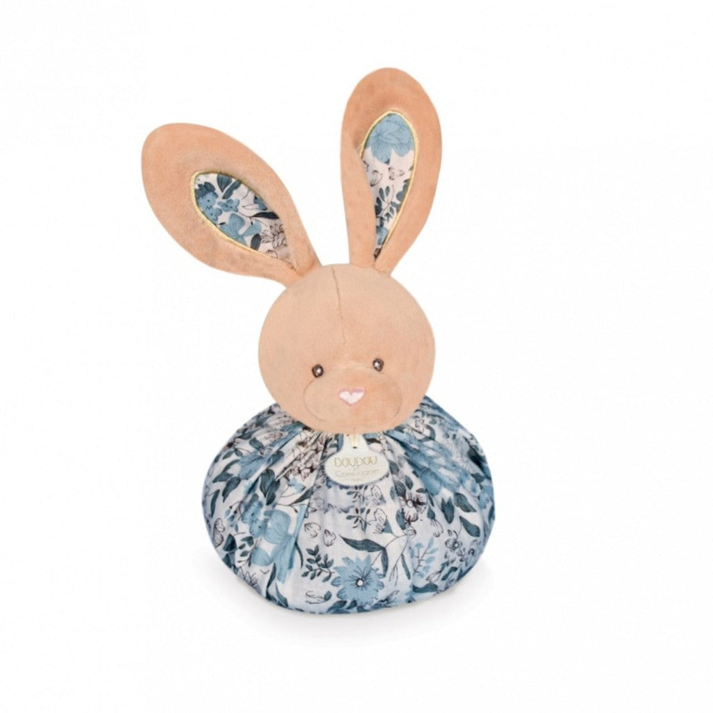Baby comforter in soft blue velour with 4 knot corners, rabbits head with patterend ear and patterned ruffle around the neck, transforms into a ball with a rabbit head