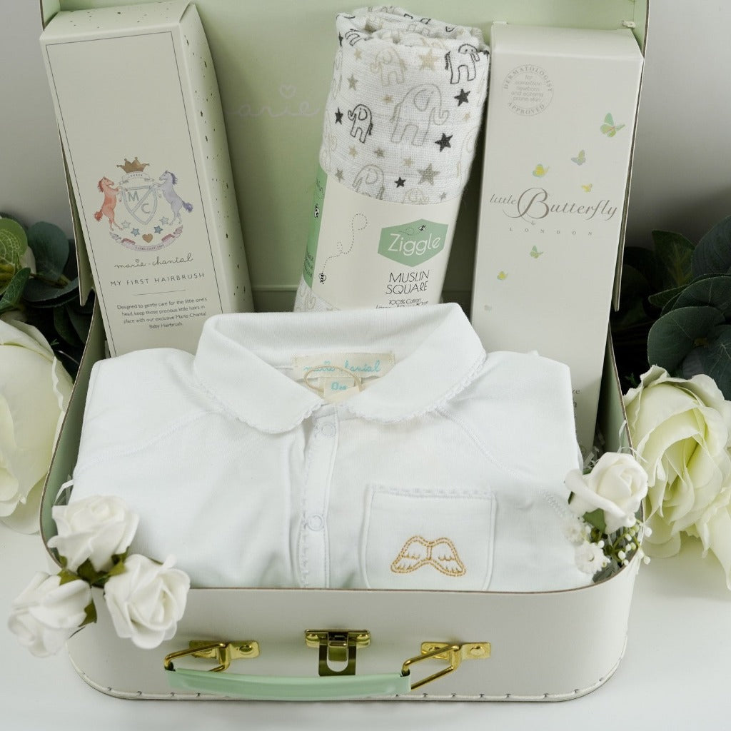 Luxury Marie- Chantal Baby Suitcase, Luxury Angel Wings white Baby sleepsuit. baby natural wooden hairbrush in heirloom box, White and grey muslin with elephants, Butterfly London baby toiletries