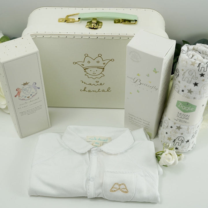 Luxury Marie- Chantal Baby Suitcase, Luxury Angel Wings white Baby sleepsuit. baby natural wooden hairbrush in heirloom box, White and grey muslin with elephants, Butterfly London baby toiletries