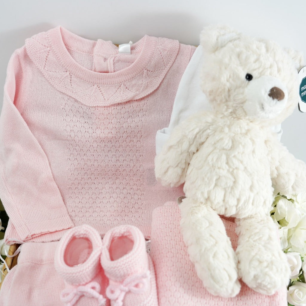 Cream soft baby teddy bear, pink fine knitted baby set including baby jumper with frilled neck, knitted bottoms with scalloped edge, pink knitted booties 