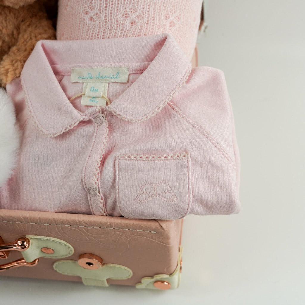 Luxury prima cotton baby sleepsuit with angel wings embroidered on pocket in a pink baby suitcase 